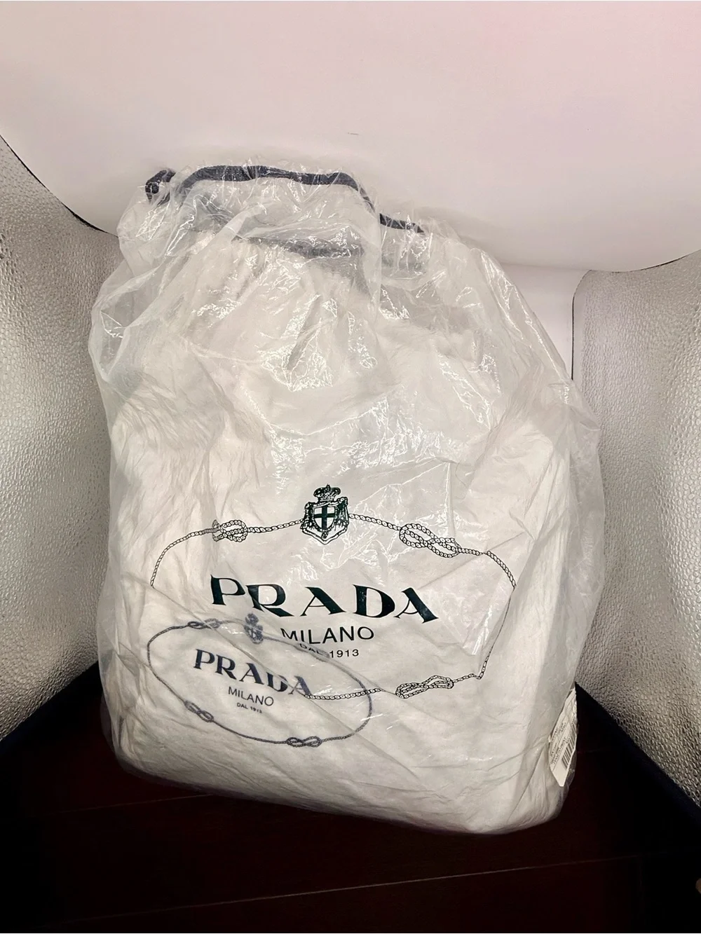 Prada Black Nylon & Leather Bag with Embossed Prada logo.
